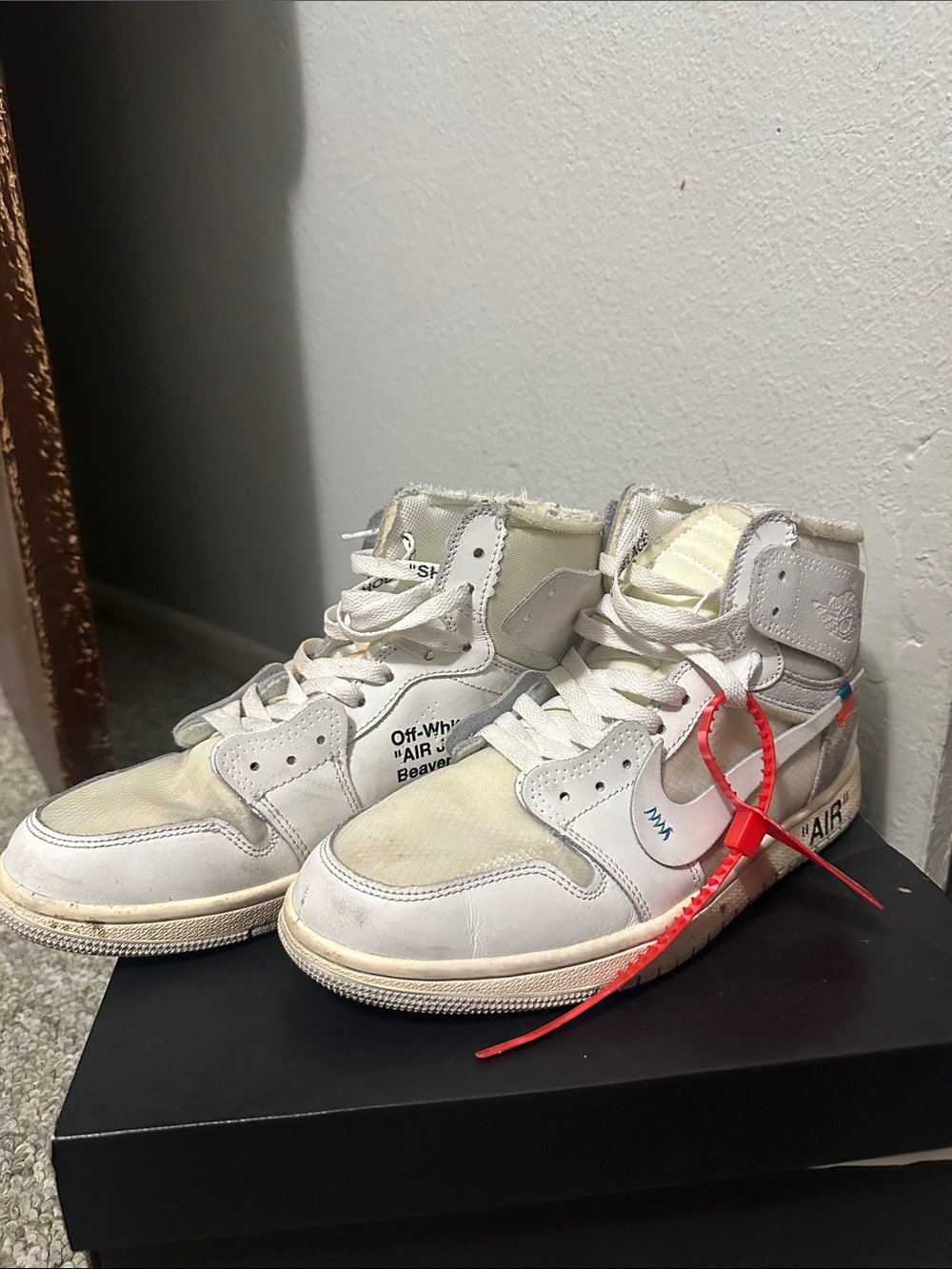 Jordan High-Top Sneakers in White and Cream with Red Zip Tie Accent